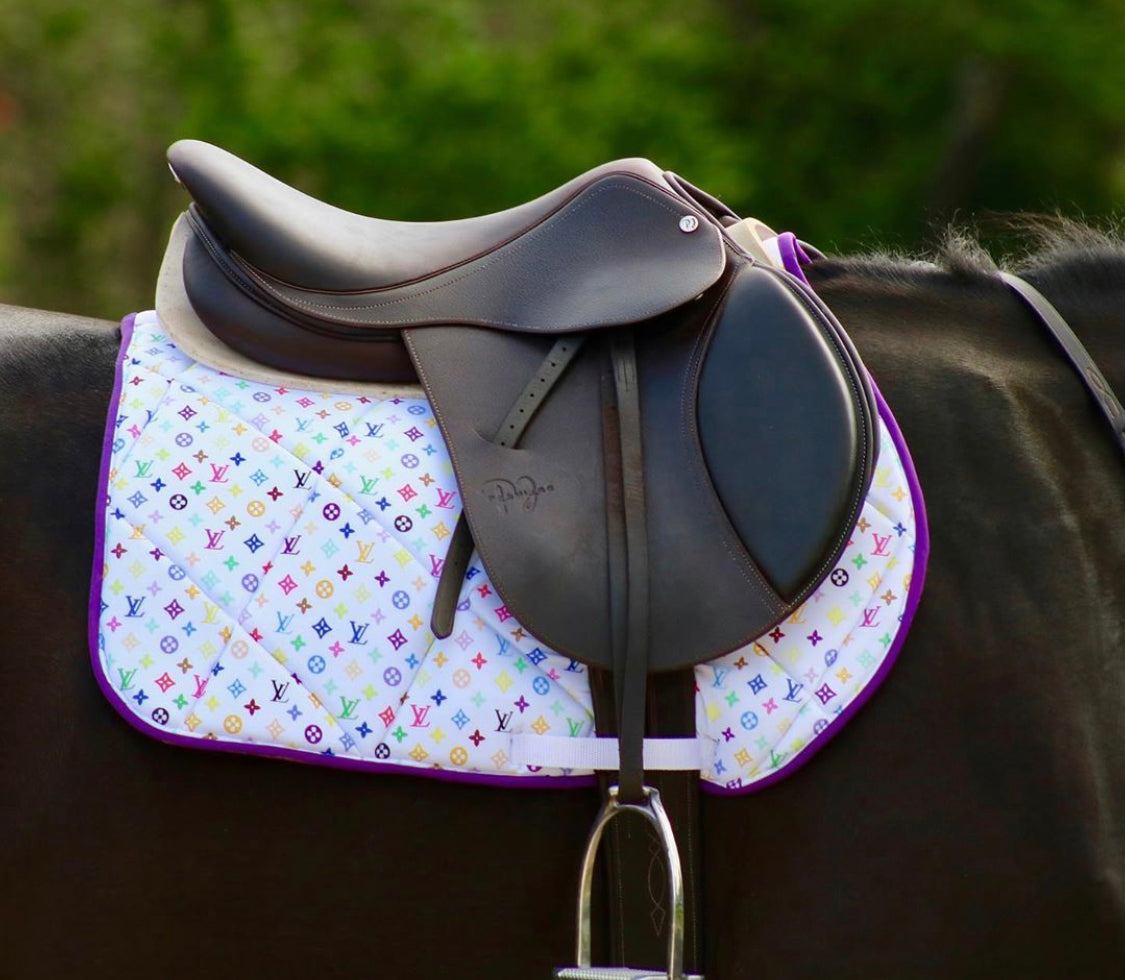 White Louis Vuitton Inspired Saddle Pad Being Used on Horse
